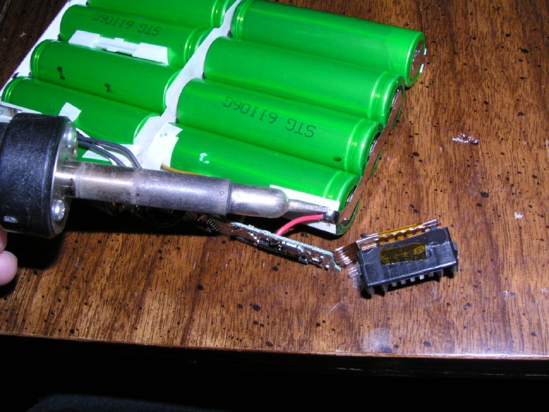 De-soldering the connecting wires.
